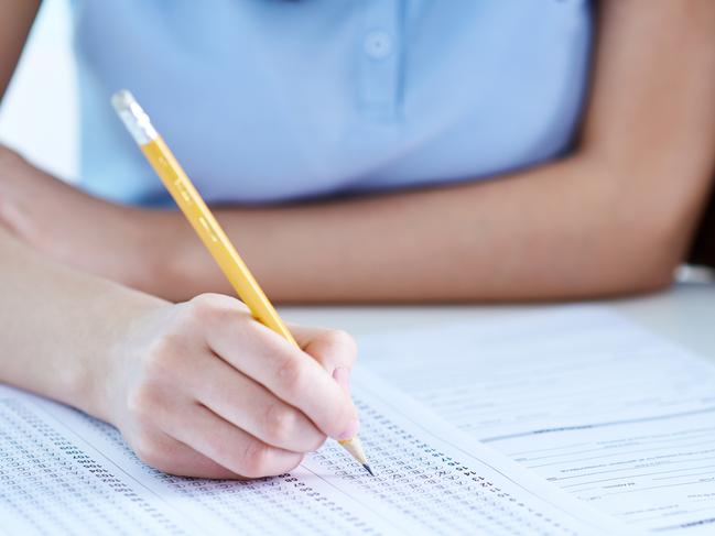 Unrecognizable girl taking exam