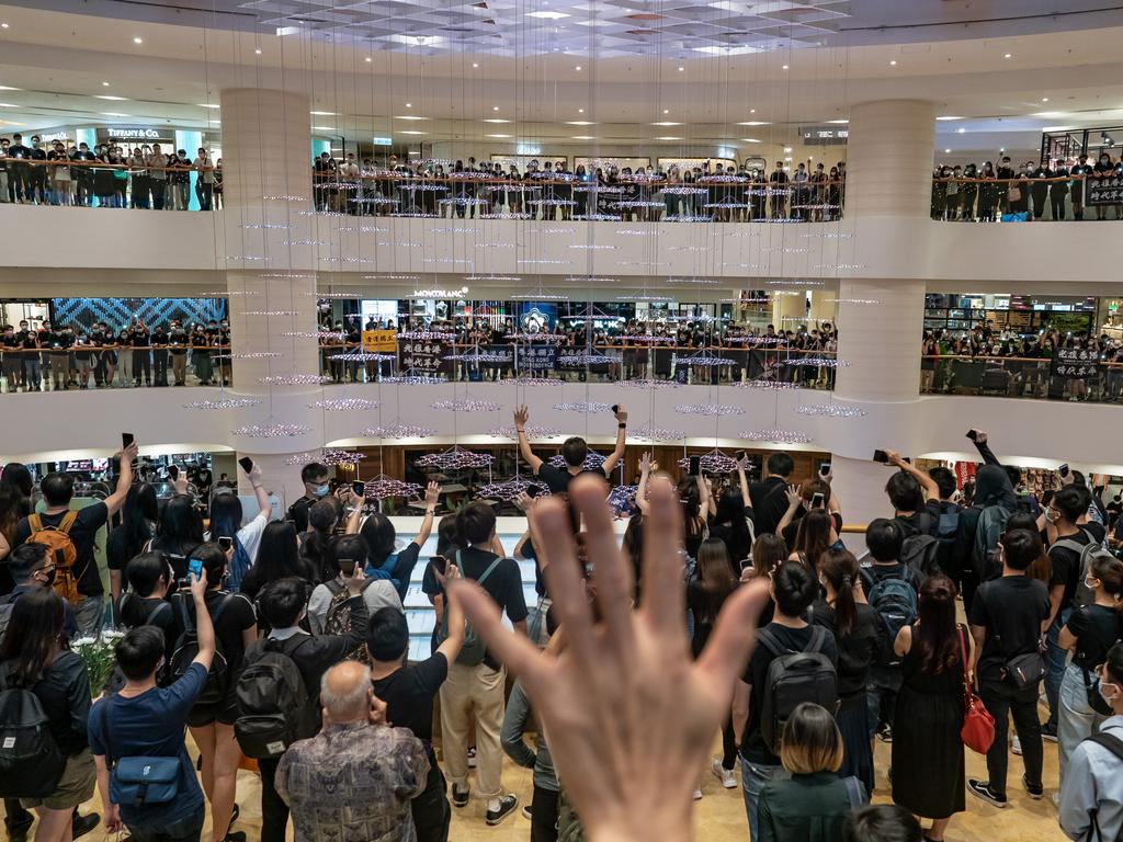 Mourners take part in the one-year anniversary memorial vigil to commemorate Marco Ling-kit Leung at a shopping mall on June 15, 2020 in Hong Kong, China. Leung fell to his death during a rally against a controversial extradition bill proposal last year. Picture: Anthony Kwan