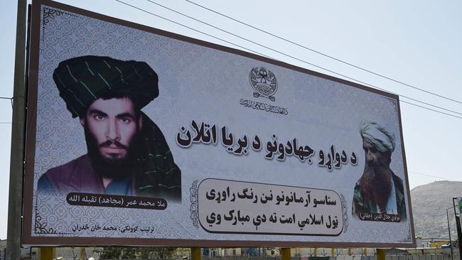 Billboard with image of Taliban leader Mullah Omar, whose death was kept secret for two years. Picture: AFP.