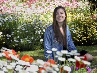 Exchange student Olivia Kuchta from the United States enjoys the colour at Laurel Bank Park. Picture: Bev Lacey