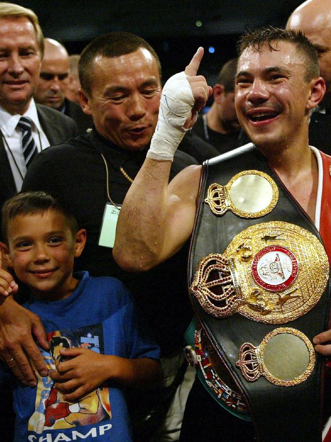 Tim, Boris and Kostya Tszyu celebrate in the ring in Melbourne. Picture: Supplied