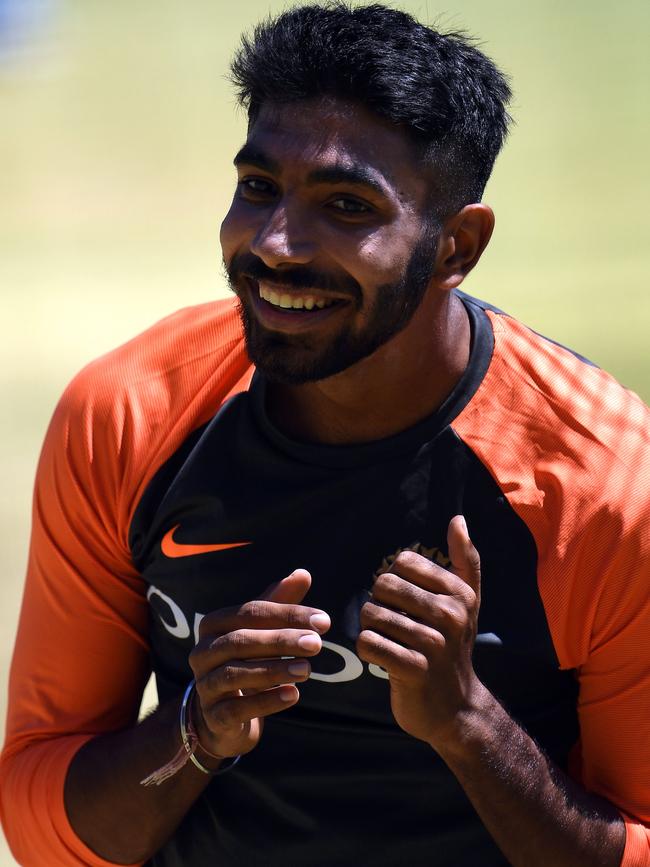 Bumrah smiles during a training session in 2018.