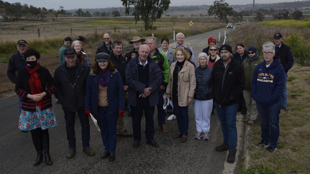 Cotswold Hills residents gather to protest the potholes and lack of maintenance on the northern end of Nugents Pinch Road.