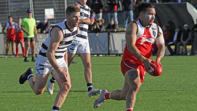 Robinvale-Euston's Isaiah Johnson burns off his South Mildura opponent on Saturday. Picture: Glenn Milne