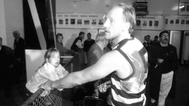 Gary Ablett with daughter Natasha Ablett in the rooms after a match in 1991.