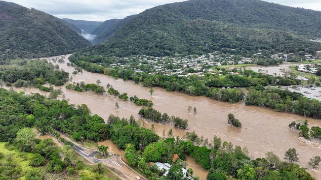 The Barron River in Cairns, Far North Queensland, reached a record flood peak, with roads closed and homes flooded in the catchment area on Sunday, December 17. Flood waters lap at the Kamerunga bridge on the Western Road, and despite the bridge remaining open, road access was cut to the northern beaches of Cairns. The record flooding were caused by Tropical Cyclone Jasper, which made landfall on December 13. Picture: Brendan Radke