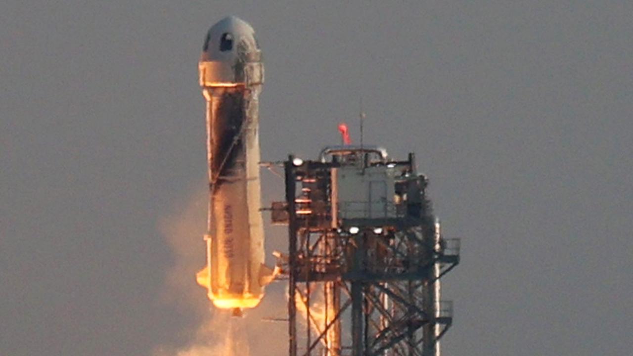 Blue Origin’s New Shepard lifts off, carrying Jeff Bezos and three others. We shan’t comment on its shape. Picture: Joe Raedle/Getty Images/AFP