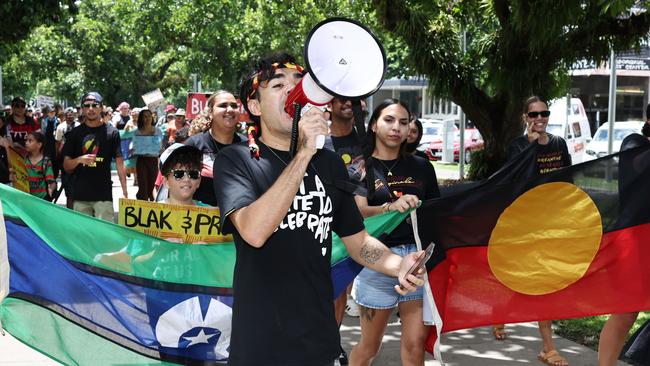 Event organiser Manny Williams leads the Invasion Day rally protest march along the Esplanade on Australia Day. Picture: Brendan Radke