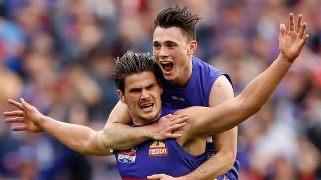 Toby McLean (top) celebrates with Tom Boyd after his iconic final quarter goal in the 2016 grand final. Picture: Adam Trafford / Getty Images