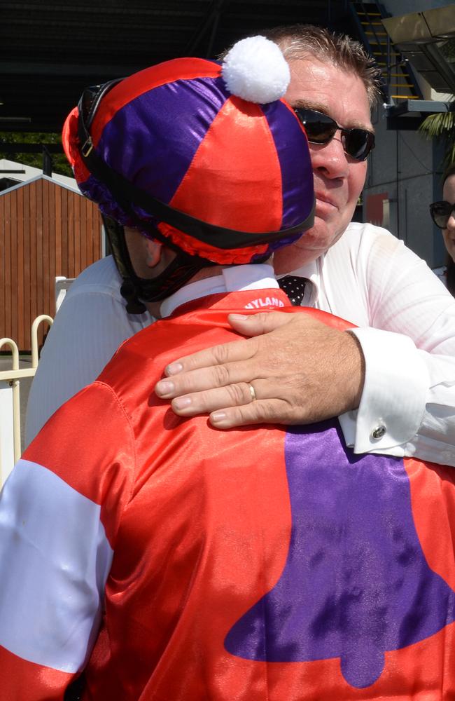 Poignant: Paul Hammersley is embraced by Tim Bell's dad Grant after Oink's win. Picture: Grant Peters, Trackside Photography