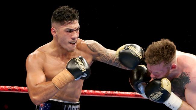 Jai Opetaia lays a punch on Lukas Paszkowsky at the Brisbane Convention Centre. Picture: AAP Image/Steve Pohlner