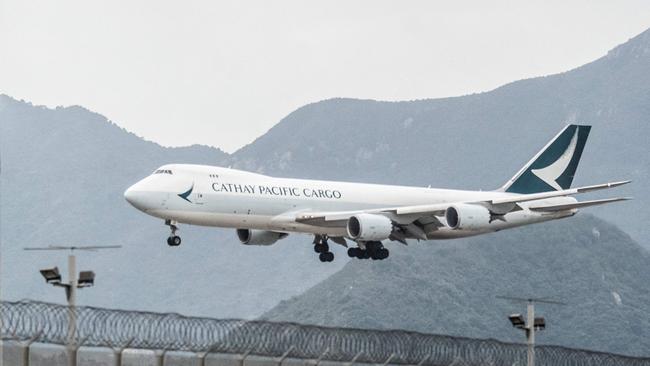 A Cathay Pacific plane lands at Hong Kong International Airport. Hong Kong is lifting flight bans on nine countries after ending its “Covid zero” hopes. Picture: AFP.