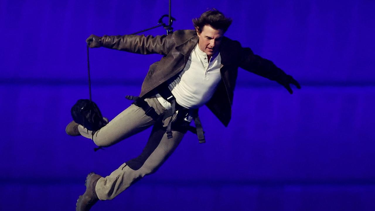 Tom Cruise jumped into the stadium to complete the LA handover. Picture: AFP