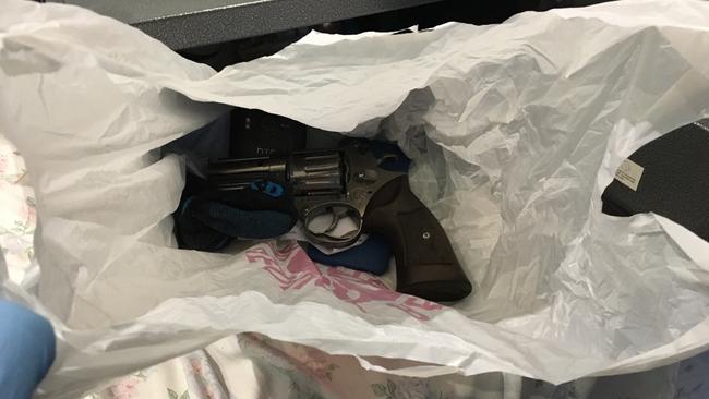 A pistol police said they seized in searches of Old Guildford houses. Picture: NSW Police Media