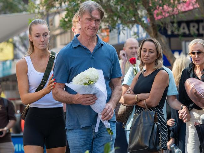 Kerry Good, Ashlee’s father, leaves flowers at the Bondi Junction memorial. Picture: Thomas Lisson