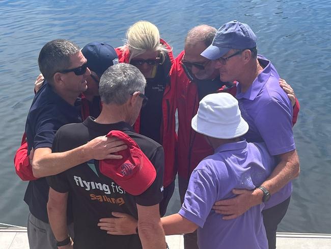 Friends of two sailors killed during the Sydney to Hobart gather for a tribute at Constitution dock in Hobart. Picture: Amanda Lulham