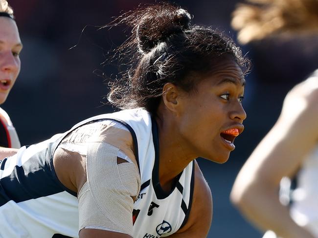 MELBOURNE, AUSTRALIA - OCTOBER 28: Vaomua Laloifi of the Blues is tackled by Paige Scott of the Bombers during the 2023 AFLW Round 09 match between The Essendon Bombers and The Carlton Blues at Windy Hill on October 28, 2023 in Melbourne, Australia. (Photo by Michael Willson/AFL Photos via Getty Images)