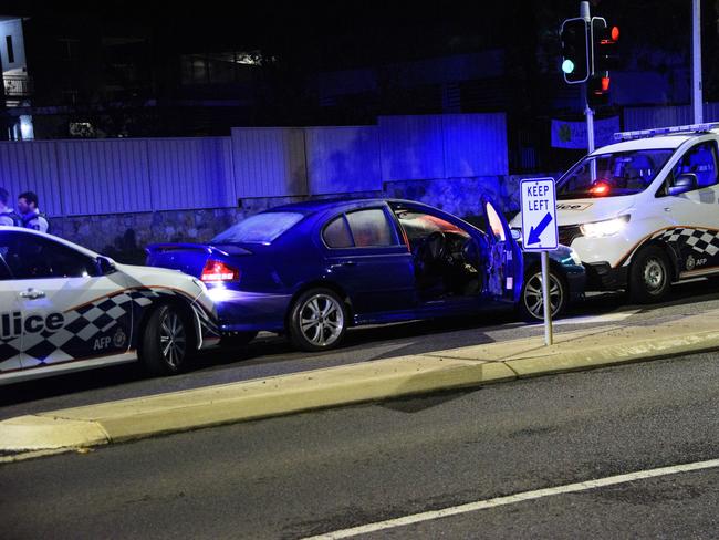 One of the AFP cars rammed the back of the stolen car as the other blocks it from driving any further. Picture: OnScene ACT