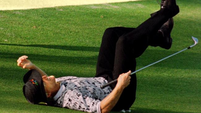 Greg Norman collapses on the green after missing a chip shot in the final round of the US Masters at Augusta in 1996. Picture: AFP