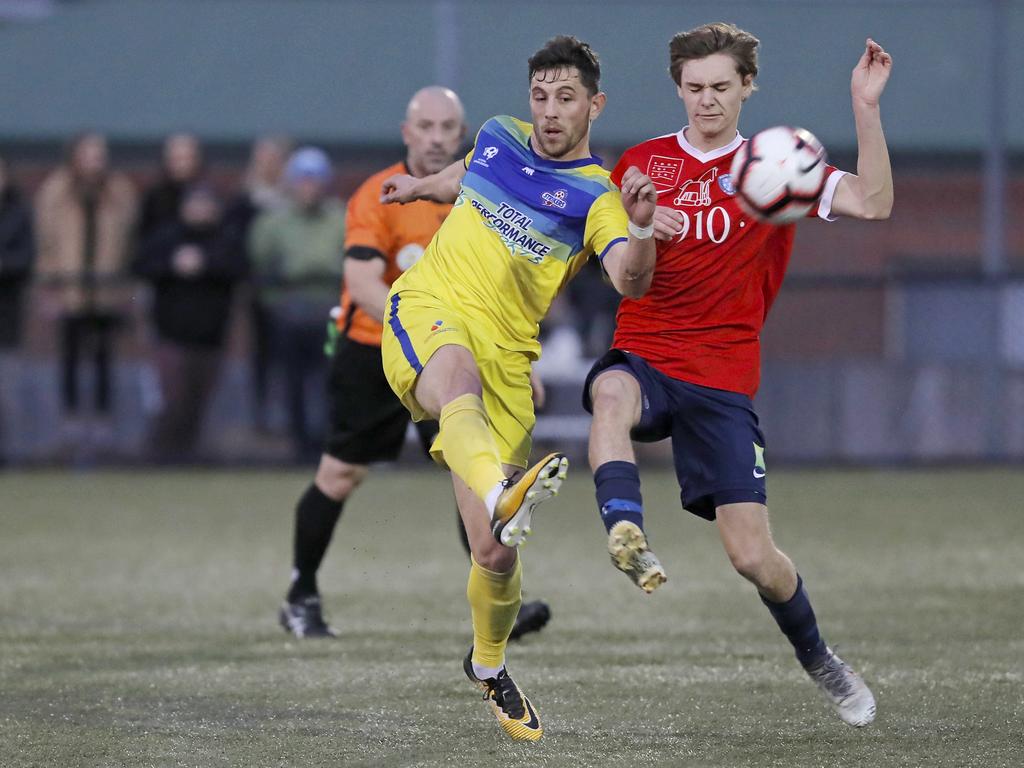 Lokoseljac Cup Final at KGV. Devonport Strikers versus South Hobart. Devonport's Joel Stone, left, and South Hobart's Bradley Lakoseljac clash. Picture: PATRICK GEE