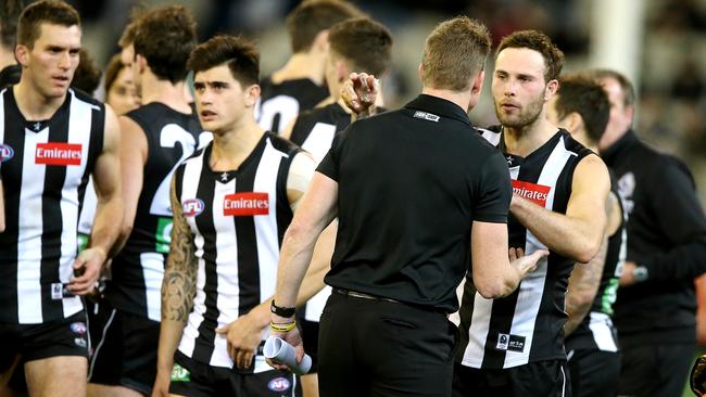 Buckley talks shop with Magpie tagger Brent Macaffer. Picture: Wayne Ludbey