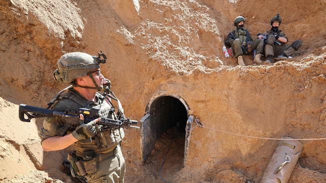 Israeli soldiers at the entrance of a tunnel in the Gaza Strip, amid ongoing fighting between Israel and the Palestinian militant group Hamas. Picture: Jack Guez/AFP