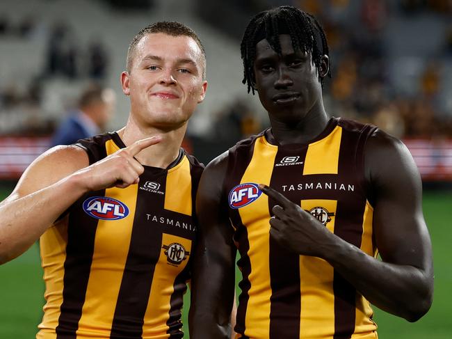 MELBOURNE, AUSTRALIA - MARCH 20: Jack Ginnivan (left) and Changkuoth Jiath of the Hawks celebrate during the 2025 AFL Round 02 match between the Carlton Blues and the Hawthorn Hawks at the Melbourne Cricket Ground on March 20, 2025 in Melbourne, Australia. (Photo by Michael Willson/AFL Photos via Getty Images)