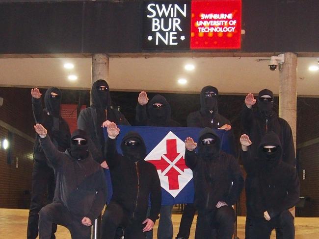 neo-Nazi group the National Socialist Network performing Hitler salutes at Swinburne University in Melbourne.