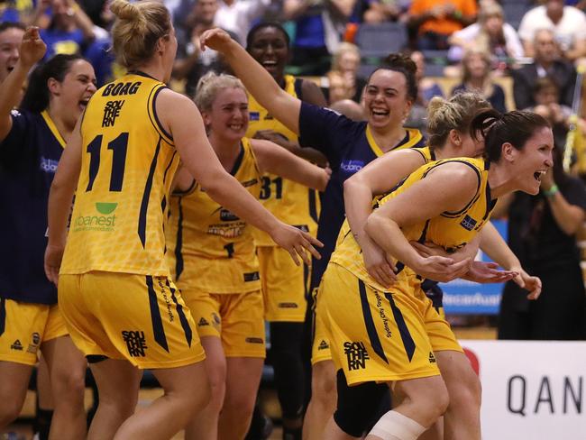 Sydney Uni Flames celebrate their WNBL win.