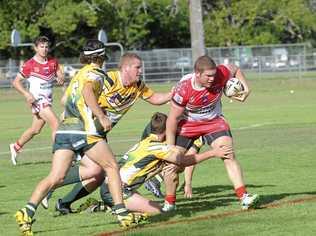 The Rebels Austin Cooper tries to break through the graps of the Orara Valley Axeman at McKittrick Park on Saturday, April 24. Picture: Caitlan Charles