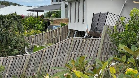 Riverstone Crossing on the Gold Coast - backyard fences falling apart after a landslip.