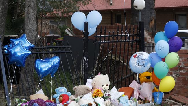 Tributes, flowers and teddy bears at the crash scene on in Wellington. Picture: Jonathan Ng