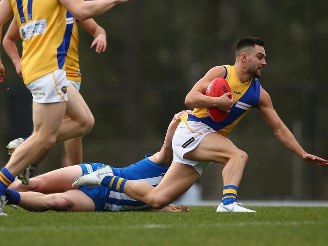 Michael Gibbons of Williamstown gets away during the round 18 VFL match against North Melbourne.