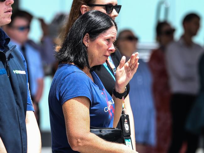 Members of the public watch the Queensland Police Memorial Service for Constable Rachel McCrow and Constable Matthew Arnold from King George Square. Picture: Zak Simmonds