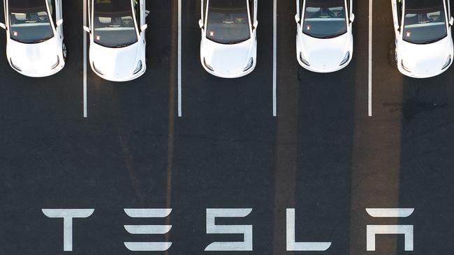 An aerial view shows cars parked at the Tesla factory in Fremont, California.