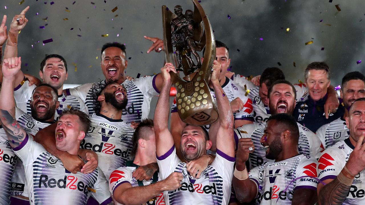 Cameron Smith of the Storm holds aloft the Premiership trophy and celebrates with teammates after winning the 2020 NRL Grand Final match at ANZ Stadium on October 25, 2020 in Sydney. Picture: Cameron Spencer/Getty Images