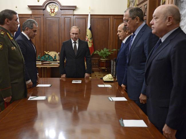 Russian President Vladimir Putin (C), Defence Minister Sergei Shoigu (2ndL), Russian Army chief of staff Valery Gerasimov (L), head of the Federal Security Service (FSB) Alexander Bortnikov (3rdR), Foreign Minister Sergei Lavrov (2ndR) and Russia's Foreign Intelligence Chief Mikhail Fradkov (R) observe a minute of silence ahead of a meeting on the results of the investigation into the Russian MetroJet Airbus A321 crash. Picture: AFP / SPUTNIK / ALEXEI NIKOLSKY