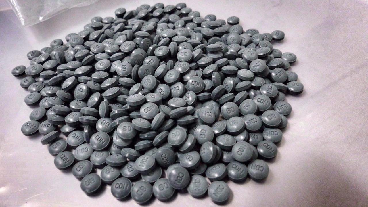 Fentanyl pills are shown in an undated police handout photo.