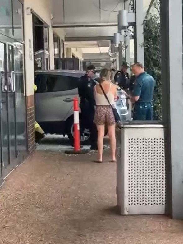 Paramedics and police on scene after a car smashed into Noodle Box in Pacific Pines. Photo: Facebook/Koby Drain