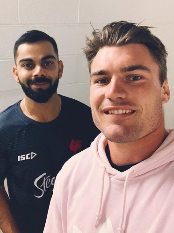 Angus Crichton with Virat Kohli.