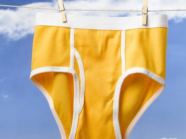 Yellow underwear hanging on washing line with sky in background, Y-fronts, undies, smalls, laundry.