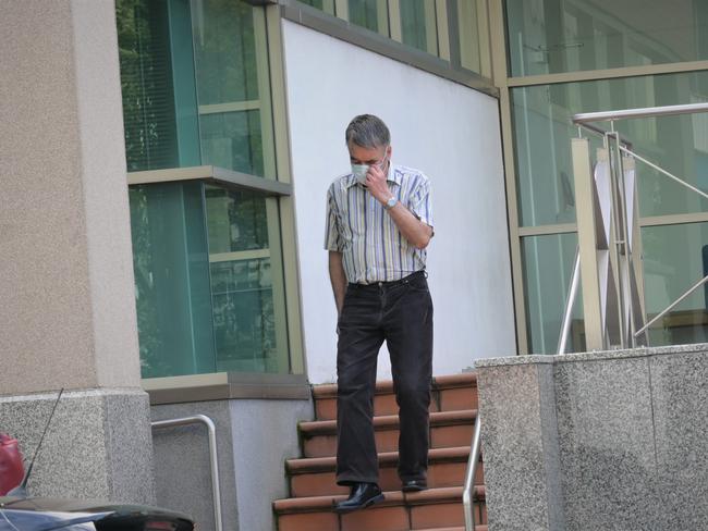 Olaf Vennik leaving the Hobart Magistrates Court after being sentenced for failing an obligation to report a death and unlawfully disposing of human remains. Picture: Kenji Sato.