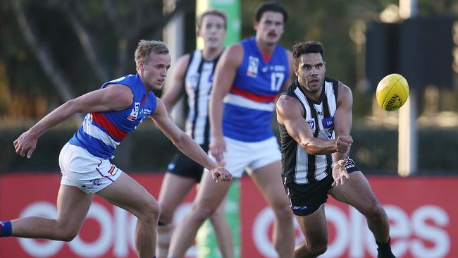 Will Hayes chases Daniel Wells. Picture: Michael Klein