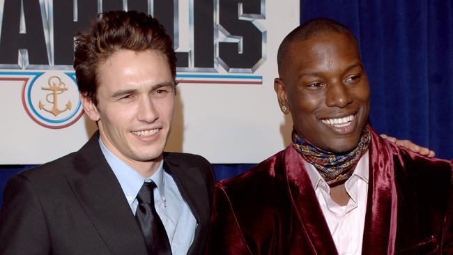 Fake smiles between James Franco and Tyrese Gibson.