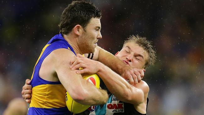 Jeremy McGovern and Ollie Wines grapple in the Power’s win at Perth Stadium. Picture: Will Russell/Getty Images