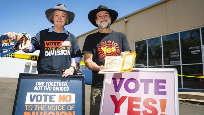 Jan Gorbacz for the No campaign and Rob Cox for the Yes campaign hand out how-to-vote cards at a referendum polling place in the electorate of Groom in Toowoomba in south-east Queensland. <span style="font-size: 11pt;">Picture: Kevin Farmer</span>