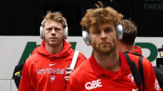 Callum Mills (left) behind likely acting captain Dane Rampe (right) at Sydney Airport on Thursday after he was ruled out of Saturday’s AFL Grand Final. Picture: Phil Hillyard