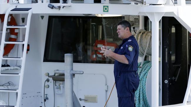 Sgt Tony Hogg prepares the water police vessel "Intrepid" to head out from Nelson Bay to search after a helicopter crashed into waters off Anna Bay. Picture: Darren Pateman