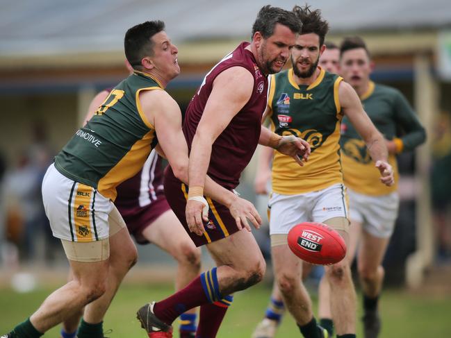 O’Sullivan Beach/Lonsdale’s Daniel Loveridge is tackled by Marion’s Dean Conier when the sides played last month. Picture: AAP/Dean Martin