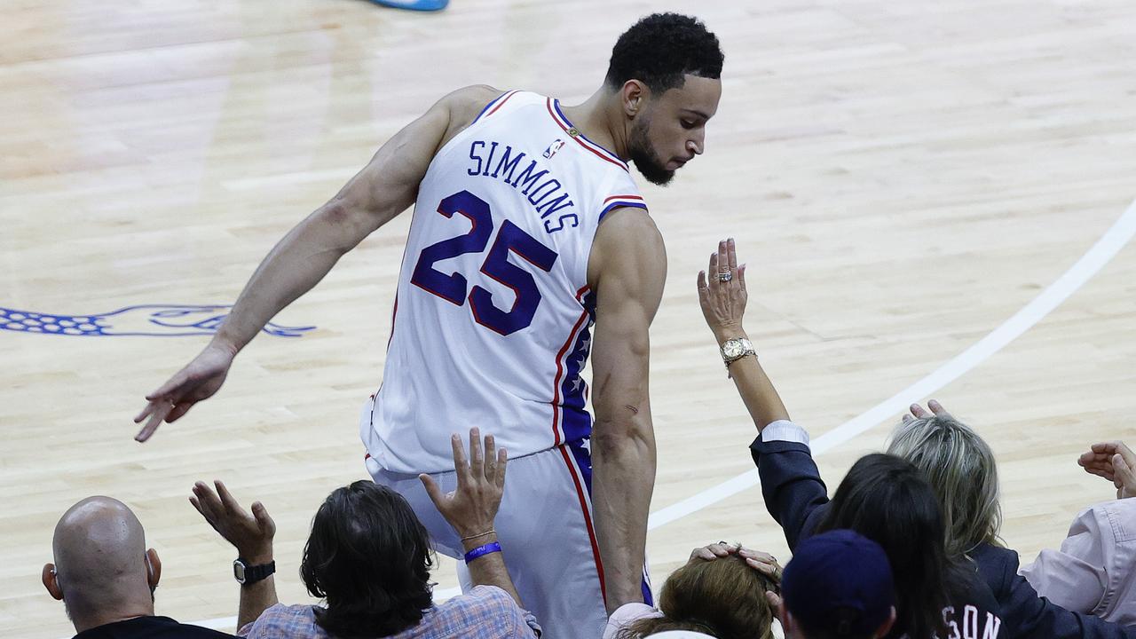 PHILADELPHIA, PENNSYLVANIA - JUNE 20: Ben Simmons #25 of the Philadelphia 76ers bumps into fans during the fourth quarter during Game Seven of the Eastern Conference Semifinals against the Atlanta Hawks at Wells Fargo Center on June 20, 2021 in Philadelphia, Pennsylvania. NOTE TO USER: User expressly acknowledges and agrees that, by downloading and or using this photograph, User is consenting to the terms and conditions of the Getty Images License Agreement. Tim Nwachukwu/Getty Images/AFP == FOR NEWSPAPERS, INTERNET, TELCOS &amp; TELEVISION USE ONLY ==